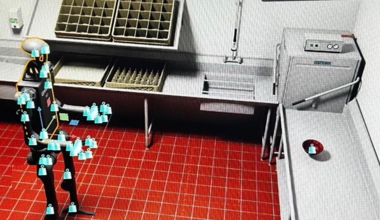 Un visor de simulación: un robot humanoide con marcadores articulares ensayando tareas en una cocina industrial virtual